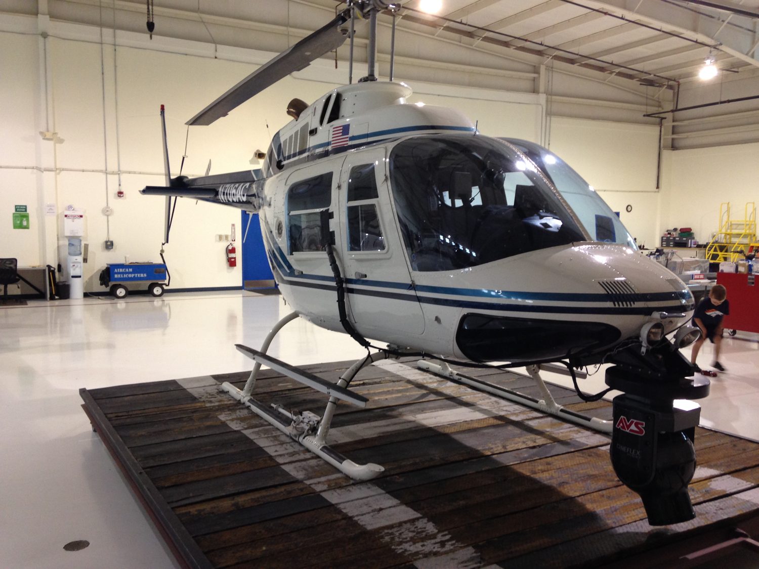 Bell helicopter with a nose camera mount in the hangar