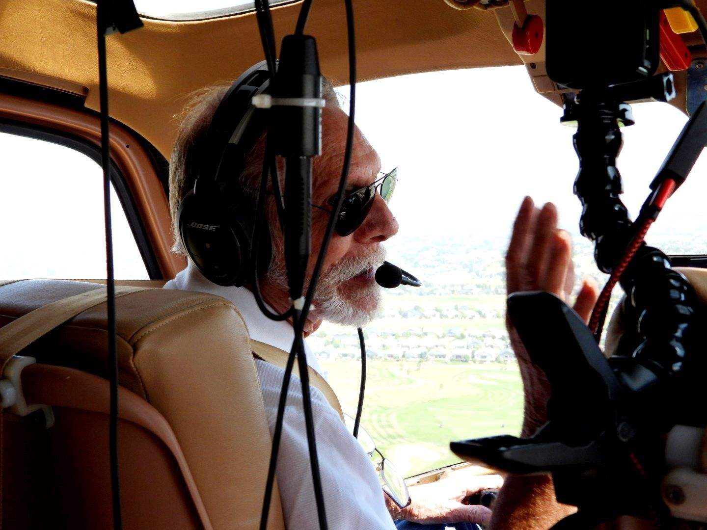 Camera operator working in the helicopter cabin