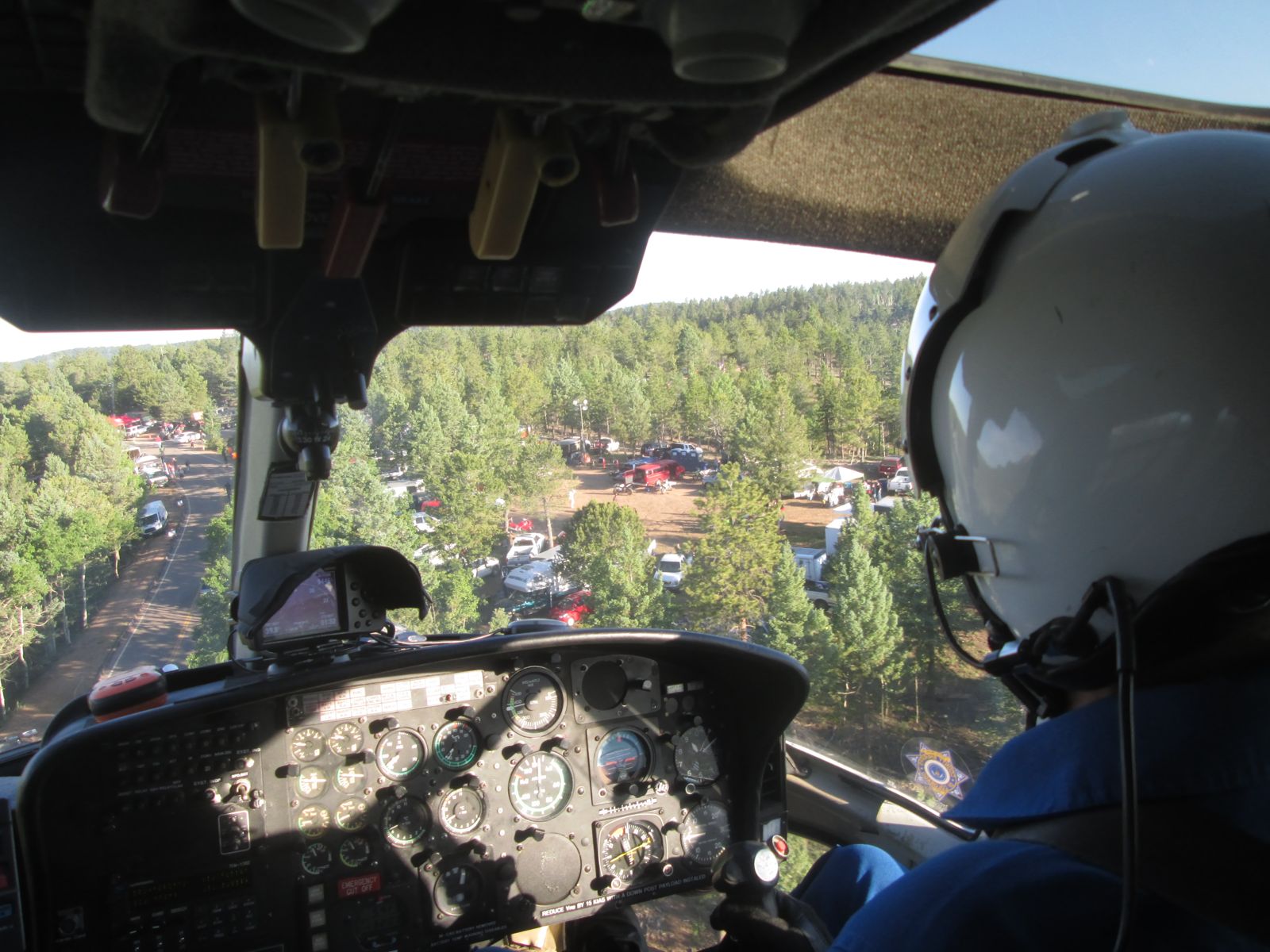 Cockpit view over mountain terrain on an AirCam mission