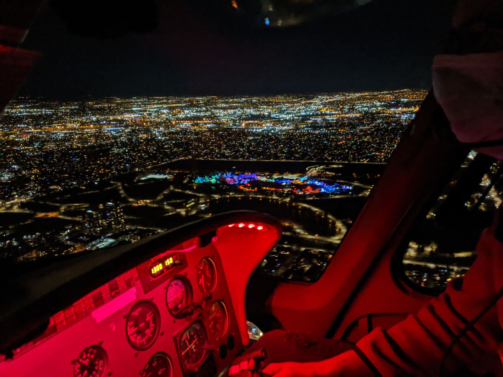 Denver city lights at night from the helicopter cockpit