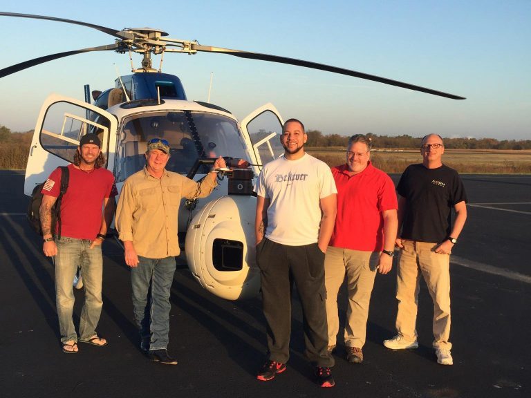 Crew standing with the TwinStar at dusk