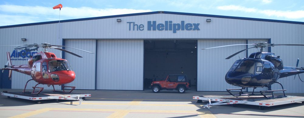 Hangar space at the Heliplex with helicopters inside