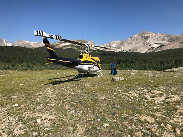 Helicopter supporting a remote construction site in the mountains