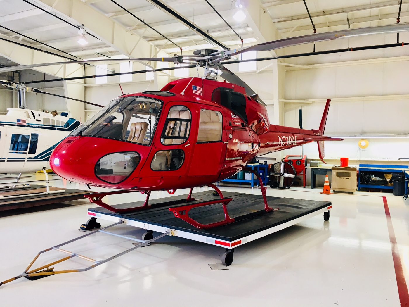 Red TwinStar on a maintenance platform in the hangar