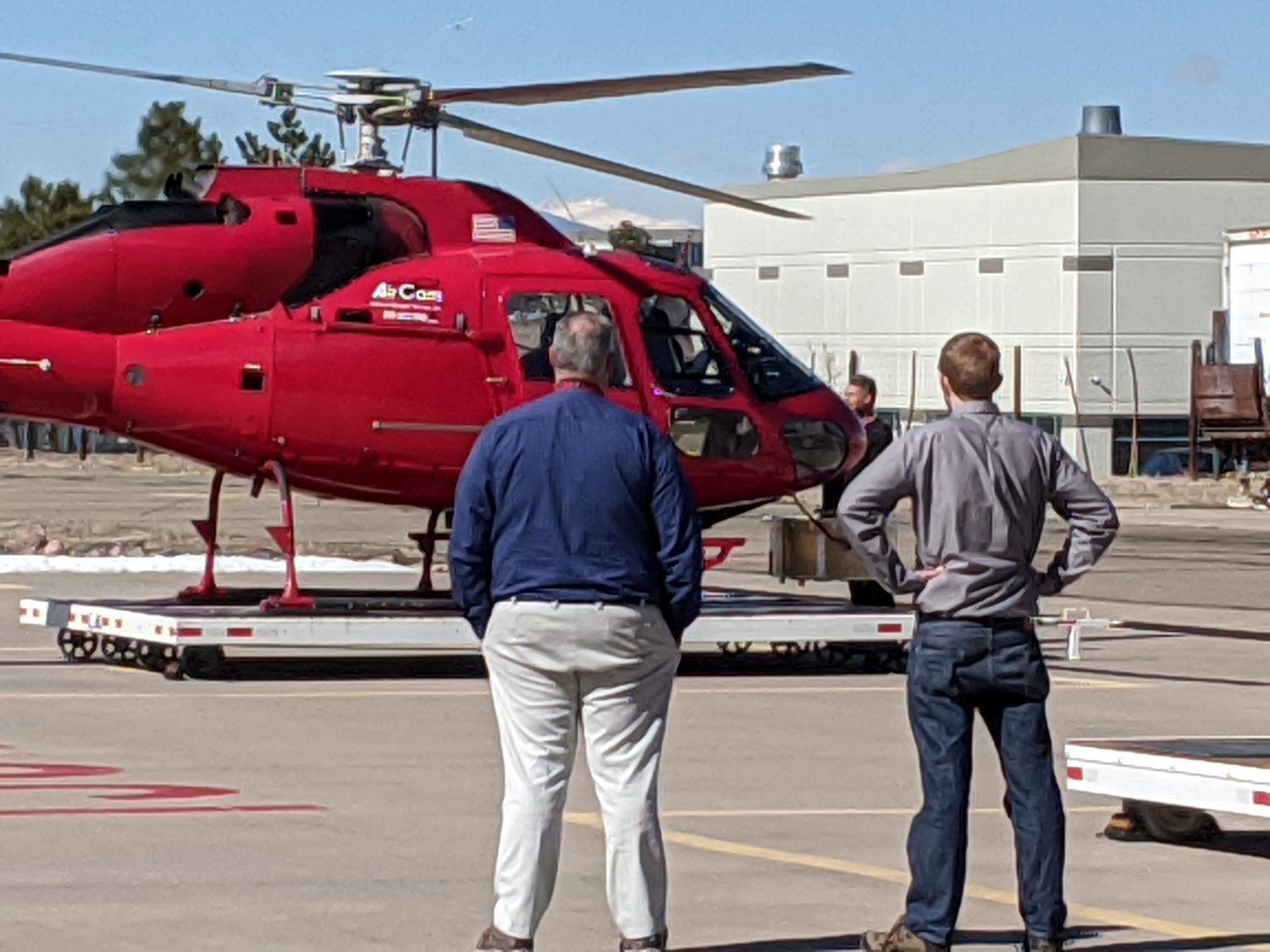 Crew inspecting the red TwinStar on a trailer