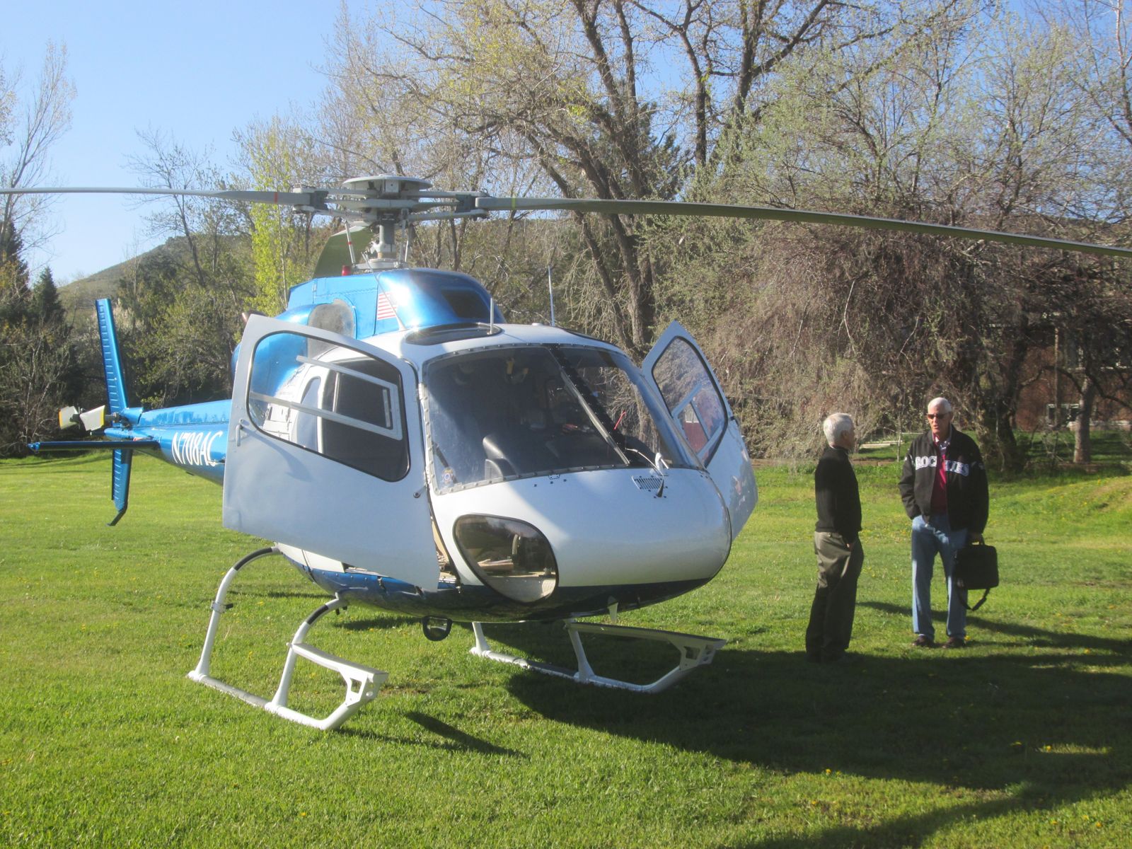 Passengers boarding an AirCam helicopter for VIP transport